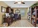 Spacious home office features built-in desk and hardwood floors at 2387 Bartolo Dr, Land O Lakes, FL 34639