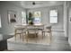 Bright dining area featuring a stylish wood table, contemporary chairs, and natural light at 2504 E 28Th Ave, Tampa, FL 33605