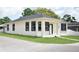 Inviting single-story home featuring a crisp exterior paint, neat lawn, and simple landscaping at 2504 E 28Th Ave, Tampa, FL 33605