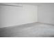 Spacious garage featuring a smooth concrete floor and freshly painted walls at 2504 E 28Th Ave, Tampa, FL 33605