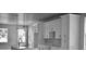 A modern, all-white kitchen with an island, sink, and stainless steel appliances at 2504 E 28Th Ave, Tampa, FL 33605