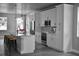 Modern kitchen with sleek white cabinets, stainless steel appliances, and a spacious center island at 2504 E 28Th Ave, Tampa, FL 33605