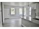 Open floor plan combining living and kitchen spaces with gray walls and light gray laminate flooring at 2504 E 28Th Ave, Tampa, FL 33605