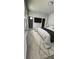 Cozy main bedroom featuring wood look floors, a walk in closet, and recessed lighting at 2504 E 28Th Ave, Tampa, FL 33605