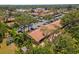Scenic aerial view of condos surrounded by lush greenery and mature trees, offering a serene living environment at 2640 Woodgate Ln # F6, Sarasota, FL 34231
