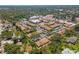 An aerial view of the community with lush tree coverage and a community pool visible at 2640 Woodgate Ln # F6, Sarasota, FL 34231