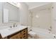 Bathroom featuring a single sink vanity and a bathtub/shower combination, enhanced by neutral walls at 2640 Woodgate Ln # F6, Sarasota, FL 34231