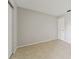 Bright bedroom featuring neutral walls and tile flooring at 2640 Woodgate Ln # F6, Sarasota, FL 34231