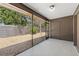 A screened-in patio offering an outdoor view of the home's gravel-covered backyard and fence line at 2640 Woodgate Ln # F6, Sarasota, FL 34231