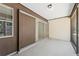 A screened-in patio features sliding glass doors, smooth flooring, and neutral walls, blending indoor-outdoor living at 2640 Woodgate Ln # F6, Sarasota, FL 34231