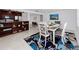 Inviting dining area next to kitchen with dining table, stylish chairs, and modern lighting at 2662 Oakbrook Dr, Largo, FL 33770