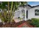 Beautiful home exterior showcasing a well-manicured yard and attached garage at 2662 Oakbrook Dr, Largo, FL 33770