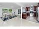 Open-concept kitchen with stainless steel appliances, granite countertops, and ample cabinet space at 2662 Oakbrook Dr, Largo, FL 33770