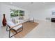 Sunlit living room boasting clean lines, neutral tones, and a comfortable seating arrangement at 2662 Oakbrook Dr, Largo, FL 33770