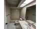 Full bathroom featuring a skylight, bathtub and shower combination, and single sink vanity at 2826 Rampart Cir, Clearwater, FL 33761