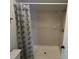 Bathroom with a walk-in shower and a geometric shower curtain at 2826 Rampart Cir, Clearwater, FL 33761