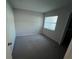 Bedroom featuring carpet flooring, window, and closet at 2826 Rampart Cir, Clearwater, FL 33761