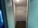 Inside view of a closet with multiple shelves and a bi-fold door at 2826 Rampart Cir, Clearwater, FL 33761