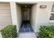 Charming front entrance featuring a stone tile entryway and lovely exterior landscaping at 2826 Rampart Cir, Clearwater, FL 33761