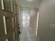 Entryway featuring tile floors, neutral walls, and an open view into the living spaces and kitchen at 2826 Rampart Cir, Clearwater, FL 33761