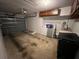 A practical garage space featuring a washer, dryer, and ample storage with room for parking at 2826 Rampart Cir, Clearwater, FL 33761