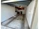 The garage interior features painted walls, overhead storage, and a clean, functional design at 2826 Rampart Cir, Clearwater, FL 33761