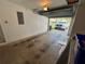 Spacious garage with an open door and an exterior view of the house and car at 2826 Rampart Cir, Clearwater, FL 33761