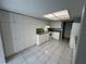Bright kitchen with ample storage, white cabinets, and modern appliances at 2826 Rampart Cir, Clearwater, FL 33761