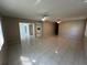 Open living area with tile floors seamlessly connects to the kitchen, perfect for gatherings at 2826 Rampart Cir, Clearwater, FL 33761