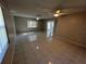 Spacious living room with neutral walls, tile flooring, and bright natural light from windows at 2826 Rampart Cir, Clearwater, FL 33761