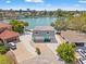 Aerial view showcasing a charming home with private dock, lush landscape, and waterfront views at 3021 Alton Dr, St Pete Beach, FL 33706