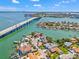 Picturesque aerial view highlighting waterfront homes, serene canals, and a scenic bridge at 3021 Alton Dr, St Pete Beach, FL 33706