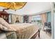 Relaxing bedroom with water views, plush bedding, and vintage-style furniture at 3021 Alton Dr, St Pete Beach, FL 33706