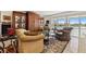 Bright living room with comfortable seating, beautiful water views, and stylish decor at 3021 Alton Dr, St Pete Beach, FL 33706