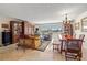 Open-concept living room and dining room with water views, comfortable seating, and classic decor at 3021 Alton Dr, St Pete Beach, FL 33706