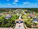An aerial view captures the entrance to the Hawk Creek community, surrounded by lush landscaping and elegant homes at 304 Hawk Talon Dr, Lithia, FL 33547