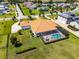 Aerial view of a single-Gathering home boasting a screened pool, spacious yard, and beautiful landscaping at 304 Hawk Talon Dr, Lithia, FL 33547