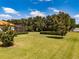 A lush backyard with mature trees and trimmed hedges provides privacy and natural beauty at 304 Hawk Talon Dr, Lithia, FL 33547