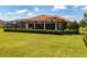 A large yard and screened-in pool provide ample outdoor living and entertaining space at 304 Hawk Talon Dr, Lithia, FL 33547