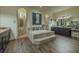 A well-lit bathroom featuring a soaking tub, granite countertops, and and showers at 304 Hawk Talon Dr, Lithia, FL 33547
