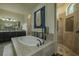 A luxurious bathroom with a soaking tub as well as separate and showers at 304 Hawk Talon Dr, Lithia, FL 33547