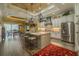 Open-concept kitchen with large island, modern appliances, and view of the breakfast nook at 304 Hawk Talon Dr, Lithia, FL 33547