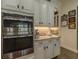 Gourmet kitchen with stainless steel appliances, built-in oven, and granite countertops at 304 Hawk Talon Dr, Lithia, FL 33547