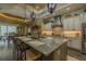 Beautiful kitchen island with seating, stainless steel appliances, and granite countertops at 304 Hawk Talon Dr, Lithia, FL 33547