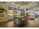 Well-appointed kitchen featuring a central island, stainless steel appliances, and ample cabinetry at 304 Hawk Talon Dr, Lithia, FL 33547