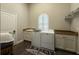 Bright laundry room featuring front loading washer and dryer, and granite countertops at 304 Hawk Talon Dr, Lithia, FL 33547