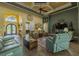 Open floor plan with wood floors, comfortable seating, and access to various areas of the home at 304 Hawk Talon Dr, Lithia, FL 33547