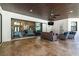 Spacious covered patio featuring comfortable wicker seating and direct access to the home at 304 Hawk Talon Dr, Lithia, FL 33547