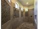 Custom walk-in shower complete with rain head and custom tile accents at 304 Hawk Talon Dr, Lithia, FL 33547