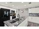 Modern kitchen featuring stainless steel appliances, granite countertops, and white cabinets at 3060 55Th N Ave, St Petersburg, FL 33714